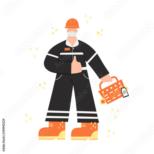 Construction or factory worker wearing hard hat, face mask, work clothing and boots. Worker during covid pandemic with LOTO box, locks; tags. Health and safety at work. PPE photo