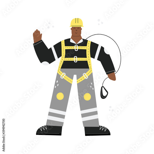 Construction or factory worker wearing hard hat, safety harness, face mask, work clothing and safety boots. Black man ready to work at height. Health and safety at work. PPE