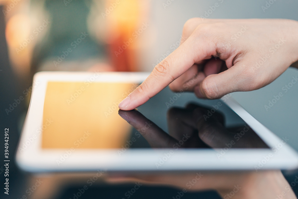 a finger is touching on a tablet computer screen a finger is touching on a tablet computer screen