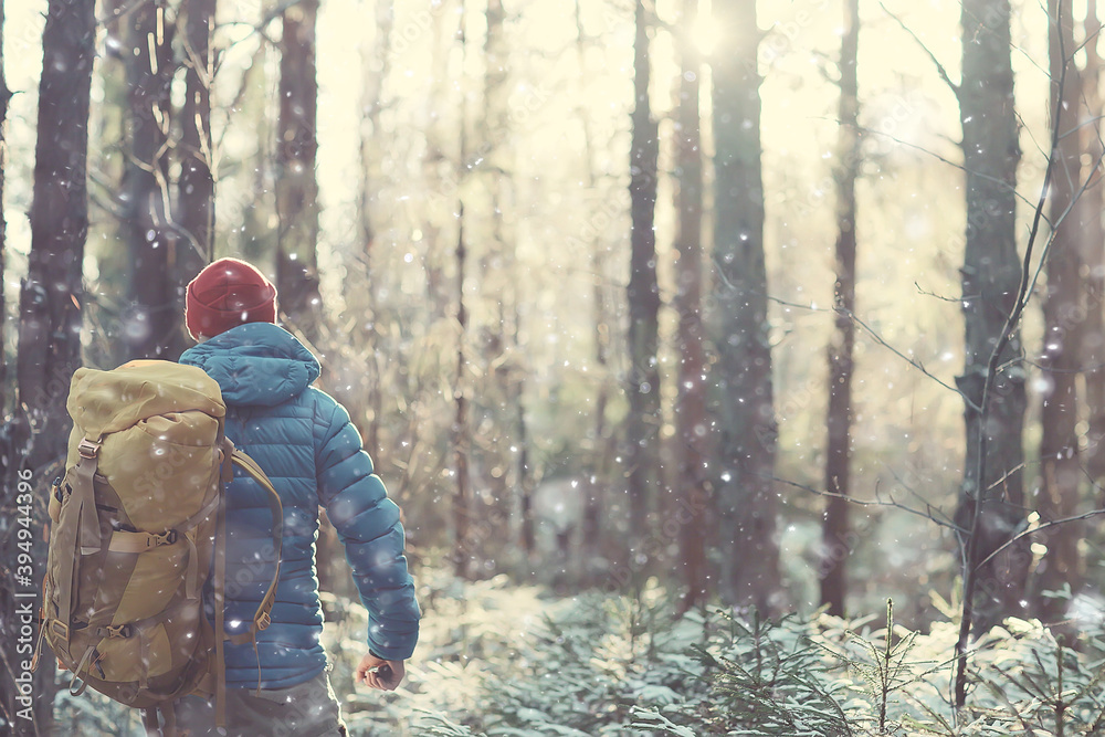 winter landscape man with a backpack / nature landscape a man on a hike with equipment in snowy weather in Canada