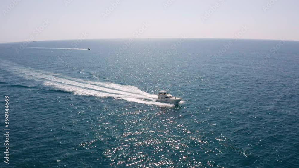 Boat sailing at full speed in the sea, pleasure craft going fast, located in sete, south of france
Boat sailing at full speed in the sea, pleasure craft going fast, located in sete, south of france