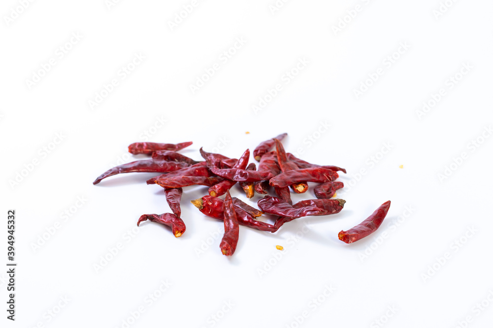 Fotografie Dried red chili on white background, pile of red dried chilli pepper cayenne