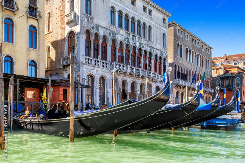 Gondolas in Venetian Canal in Venice, Italy