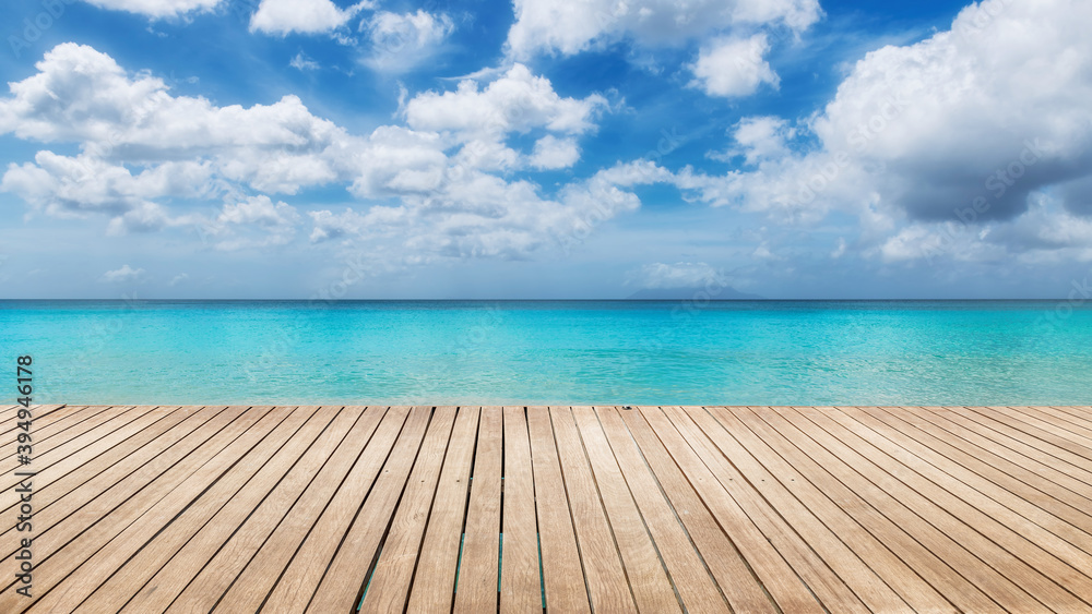 Fototapeta premium Tropical Sunny beach with wooden floor and the turquoise sea on Paradise island.