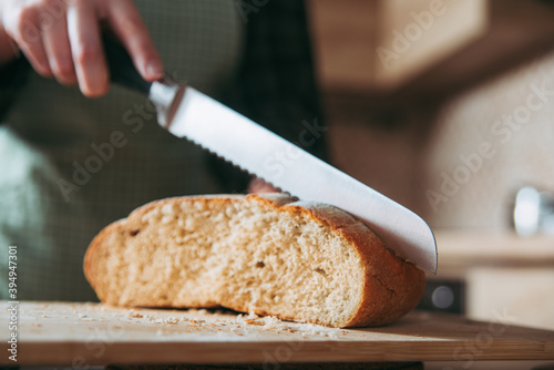 cutting bread on a cutting board.