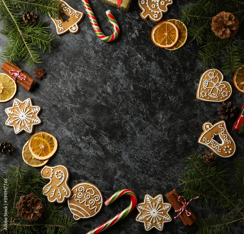 Christmas concept with cookie on black smokey background, space for text