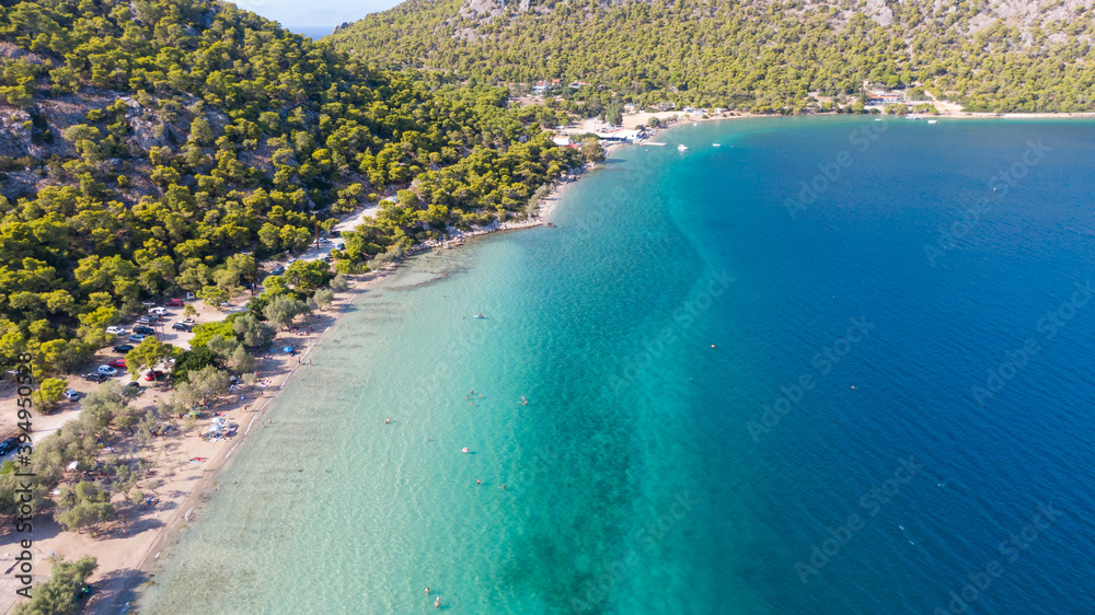 Peloponnese, Greece Aerial view on turqouise blue water and sandy beach. Limni Vouliagmeni or Ireon Lake, 