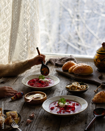 Traditional Russian lunch with borsch and pies