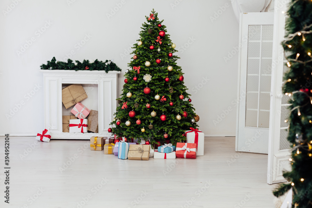 Perfect Christmas tree with gifts underneath in living room Perfect Christmas tree with gifts underneath in living room