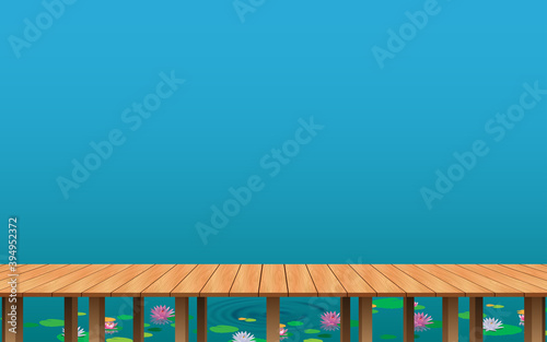 landscape of wooden bridge on the lotus swamp in daytime