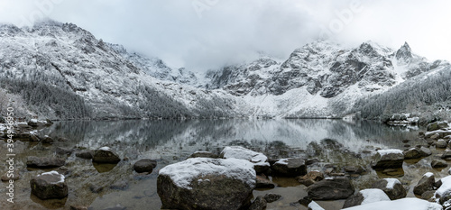 Panoramic view of scenic idyllic winter landscape in the poland tatras at famous mountain lake Eye of the Sea or Morskie Oko, Tatras Mountain poland photo