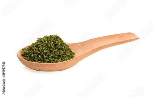 dry thyme in wood spoon on white background