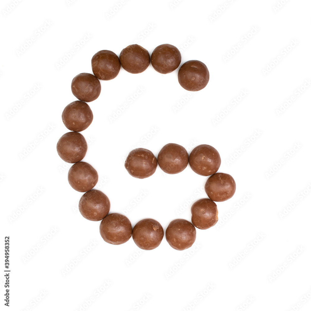 The 'G' written in chocolate Pepernoten The 'G' written in chocolate Pepernoten