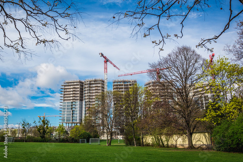 Canvas Print Construction sites of residential buildings seen from Schweizergarten park in Vi