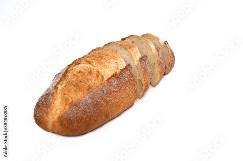 Fresh daily baking healthy plain sourdough loaf sliding into small pieces dropped shadows isolated white background 