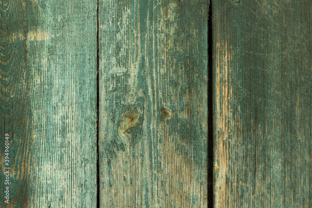Dark old wooden surface made of separate wooden boards with the remains of paint Dark old wooden surface made of separate wooden boards with the remains of paint