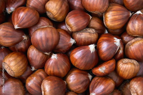 Raw chestnuts food background close up. Top view