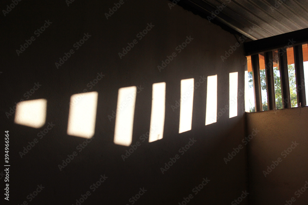 The sun shines through the window, in the morning light.
The sun shines through the window, in the morning light.