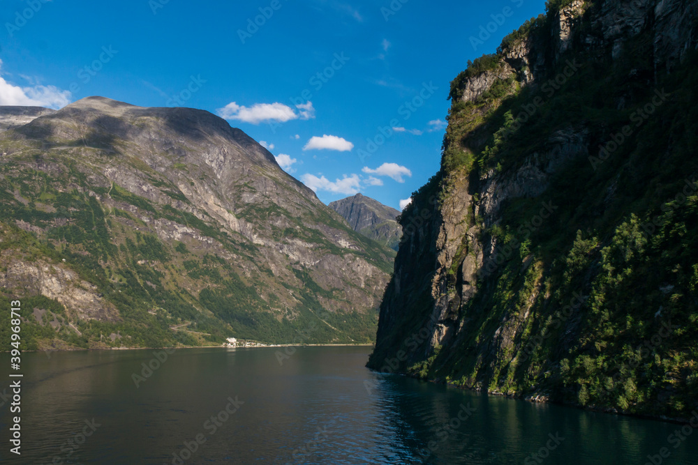 Panoramic view of the Geiranger fjord near the port of Geiranger, Norway. Nature of Norway. View from the Cruise Ship on the fjord in Norway
Panoramic view of the Geiranger fjord near the port of Geiranger, Norway. Nature of Norway. View from the Cruise Ship on the fjord in Norway