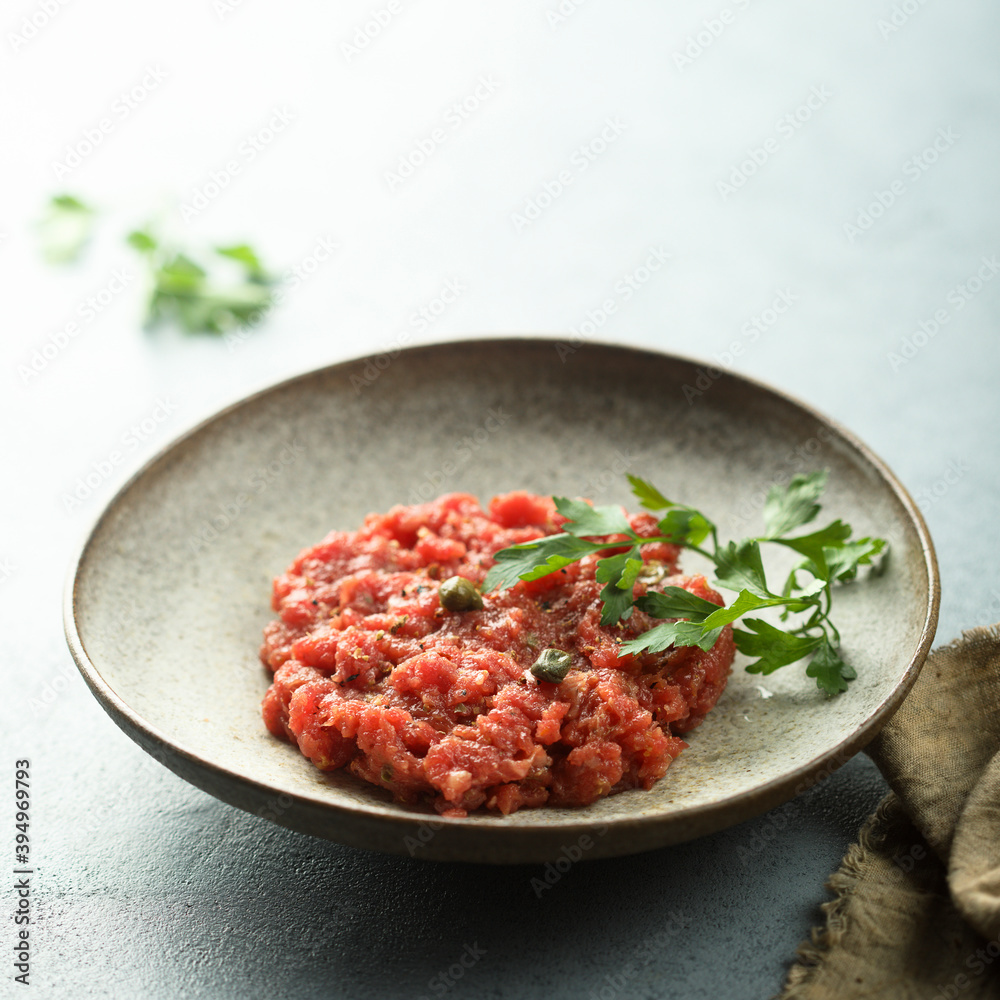 Traditional homemade steak tartare with capers Traditional homemade steak tartare with capers
