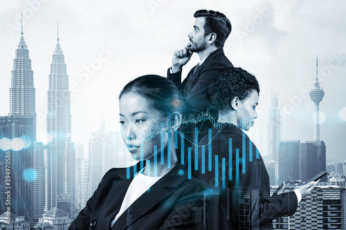 Photography Group of business colleagues in suits as a part of multinational corporate team working on forecasting trading corporate strategy at fund