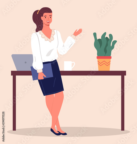 Businesswoman with ponytail, wearing blouse and skirt, holding folder in hand and gesturing. Business lady lean on table with laptop, cup and plant. Confident smiling woman, office worker portrait