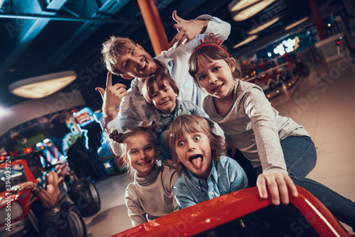 Dad with children have fun in entertainment center photo