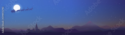 Night landscape of Santa Claus passing over a village in a starry sky (panoramic)