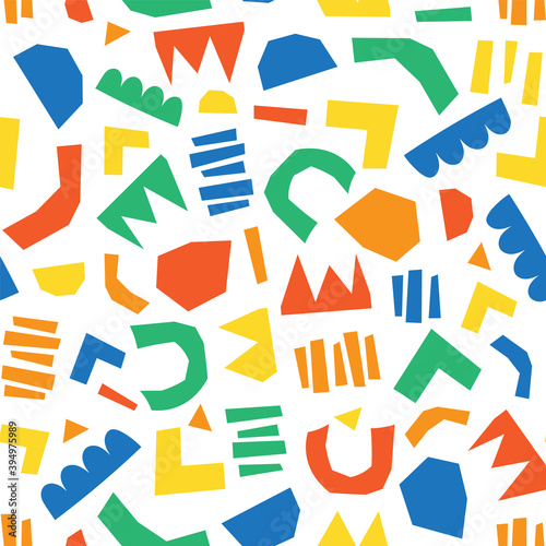 Modern abstract kids paper cut out shapes background. Seamless colorful collage vector pattern. Contemporary art in bright colors on white. Childish simple pattern geometric shapes for fabric, decor