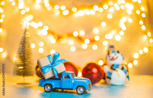 Blue retro toy car delivering gift box for christmas and new year © stenkovlad