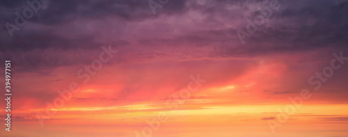 background of cloudscape with red clouds at sunset on sky © mimadeo