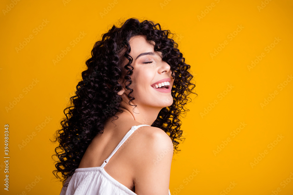 Profile portrait of charming optimistic young brown hair woman close eyes wear white top isolated on bright yellow color background Profile portrait of charming optimistic young brown hair woman close eyes wear white top isolated on bright yellow color background