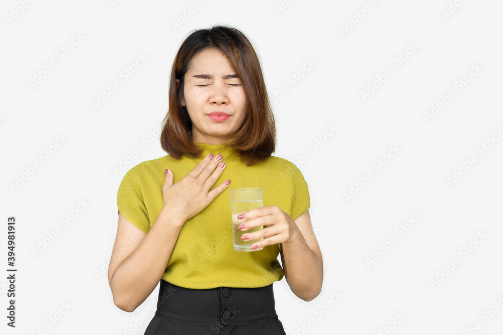 Asian woman suffering from sore throat drinking cold water Asian woman suffering from sore throat drinking cold water
