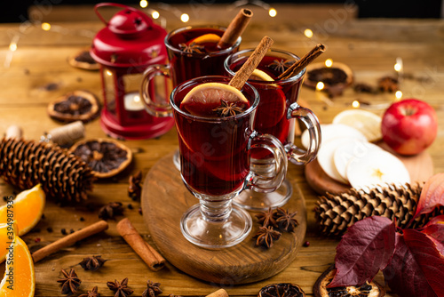 Christmas magic atmosphere, home celebration. Hot mulled wine, spices and festive decorations. Winter holidays celebration concept