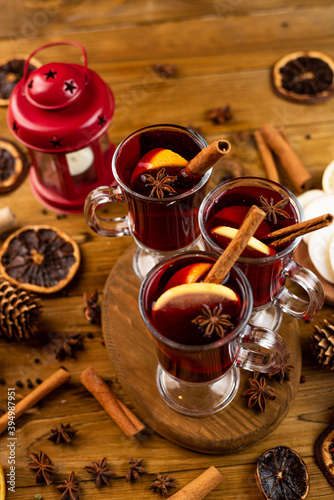 Christmas magic atmosphere, home celebration. Hot mulled wine, spices and festive decorations. Winter holidays celebration concept