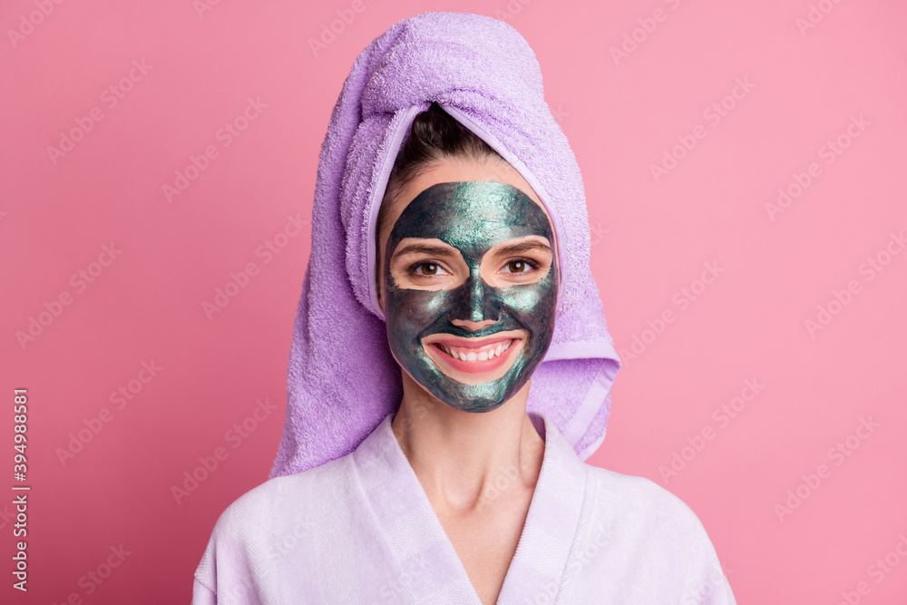 Close-up portrait of cheery housewife wearing towel turban facial glossy clay mask anti wrinkles effect isolated over pink pastel color background Close-up portrait of cheery housewife wearing towel turban facial glossy clay mask anti wrinkles effect isolated over pink pastel color background