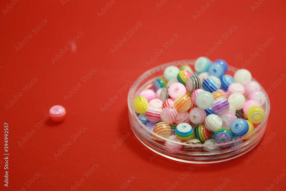 Beads in a box of different colors. Beads in a box of different colors.