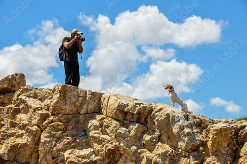 Dog photoshooting at the top of the hill