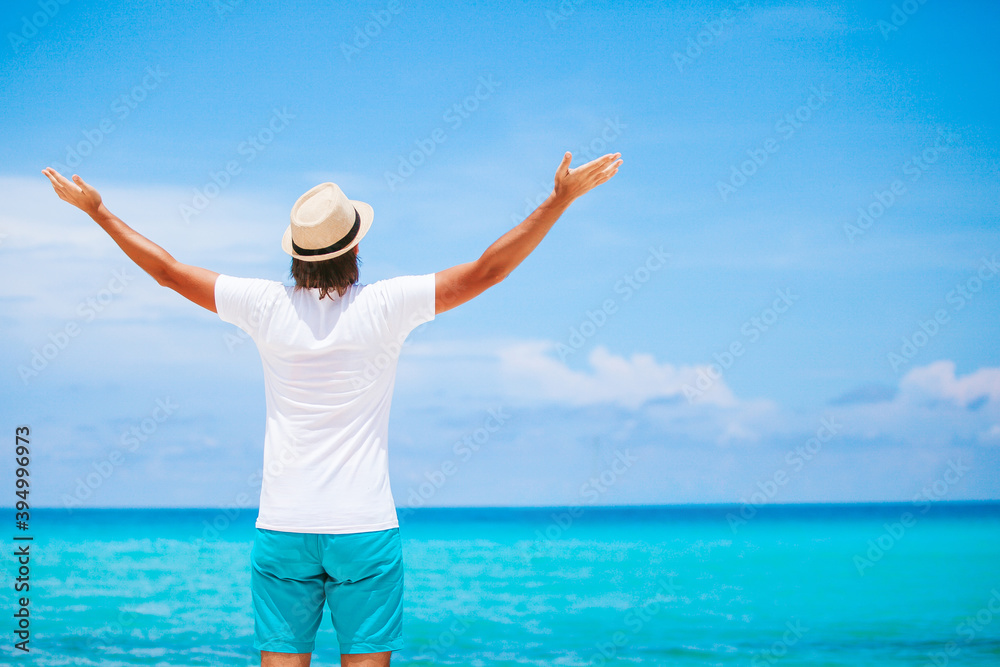 Young man on the white beach on vacation Young man on the white beach on vacation