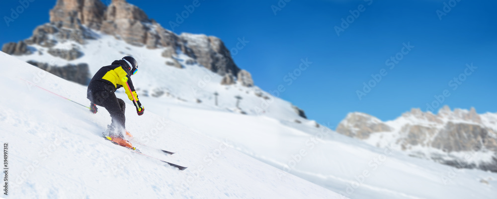 Skier in Dolomites Alps mountains