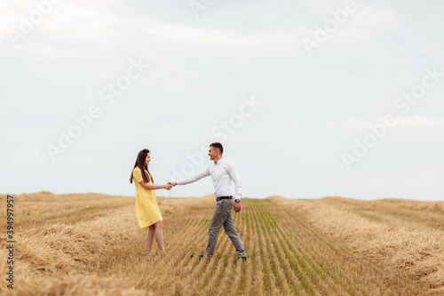 Happy young couple on straw  romantic people concept  beautiful landscape  summer season.