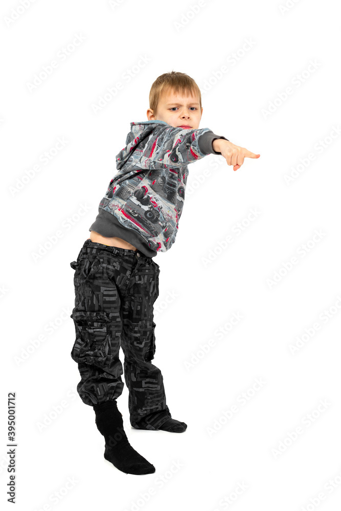 Boy grimaces and indulges on a white background. Isolated.