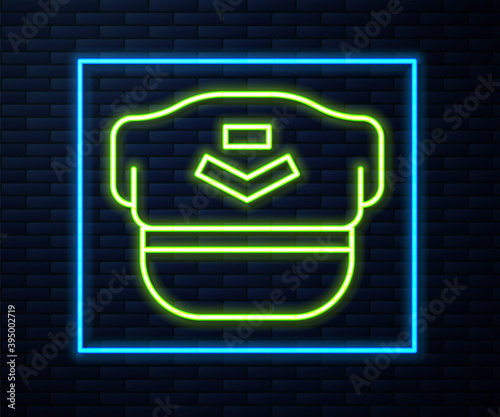 Glowing neon line Pilot hat icon isolated on brick wall background. Vector.