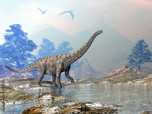 Spinophorosaurus dinosaur walking in a landscape with water by day - 3D render