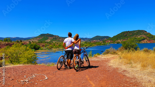 active couple biking- Lake of Salagou in France, Herault