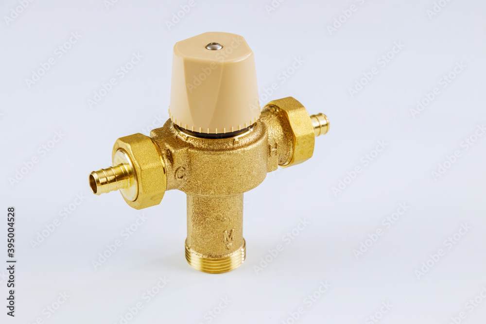 Close up water brass thermostatic mixing valve isolated on white background. Close up water brass thermostatic mixing valve isolated on white background.