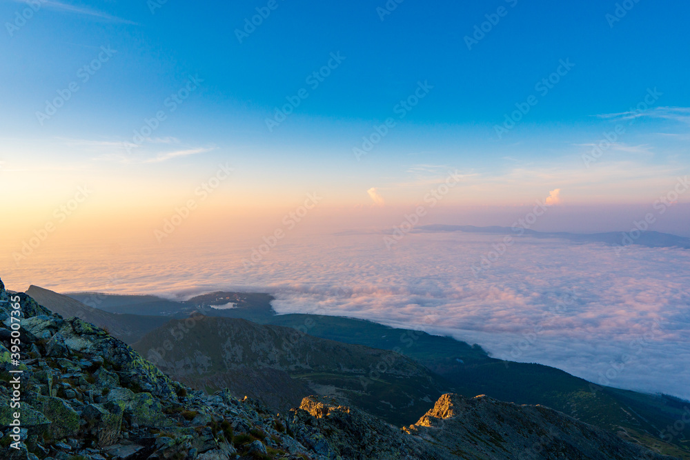 Mountains with Inversion at sunrise as seen From Krivan Peak in High Tatras, Slovakia