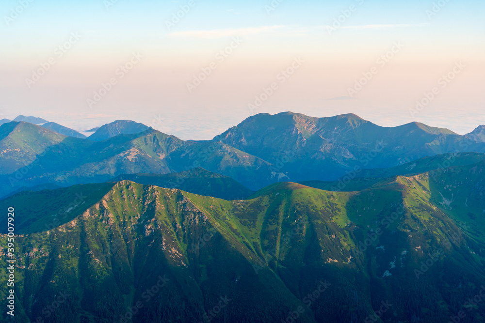 Scenic image of Fairytale mountains during sunrise. The sunrise over a mountain in park High Tatras. Slovakia, Europe. Wonderful Autumn landscape. Picturesque view of nature Amazing natural Background