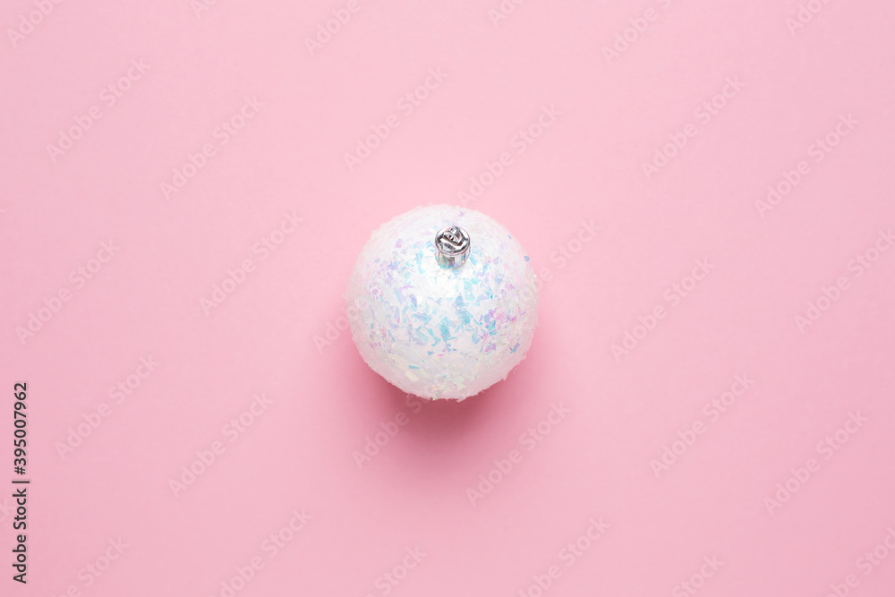 Shiny white ball on a pink background, Christmas decorations with copyspace Shiny white ball on a pink background, Christmas decorations with copyspace