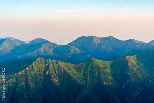 Scenic image of Fairytale mountains during sunrise. The sunrise over a mountain in park High Tatras. Slovakia, Europe. Wonderful Autumn landscape. Picturesque view of nature Amazing natural Background © Martin